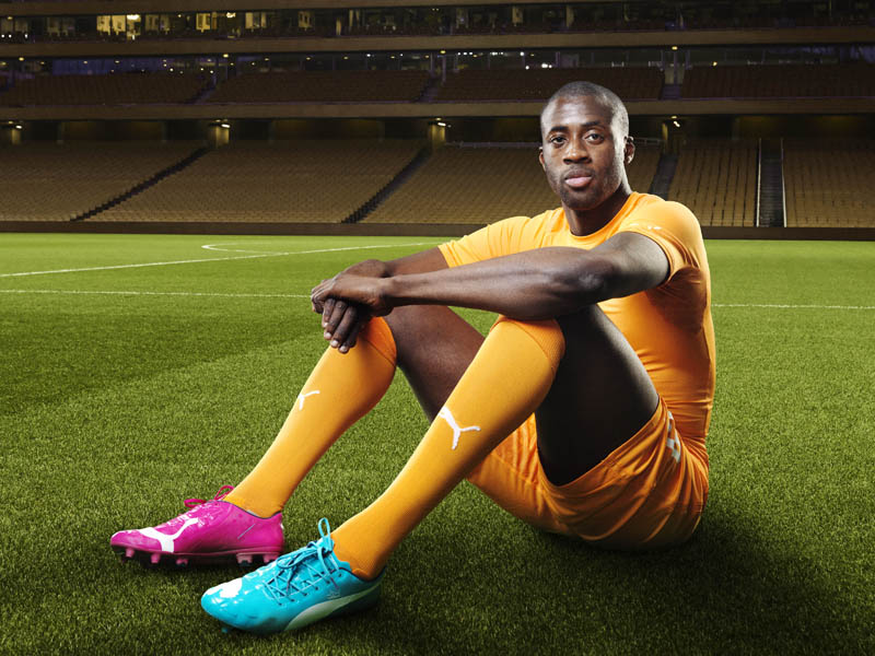 Yaya Touré in the 2014 Ivory Coast Home Kit that features PUMA's PWR ACTV Technology